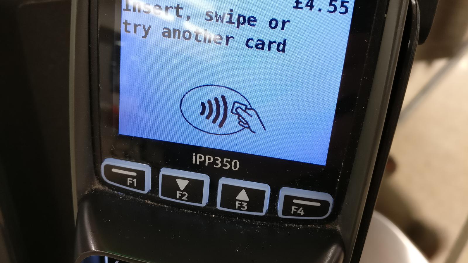 A single paper receipt on a navy desk beside a brass letter opener